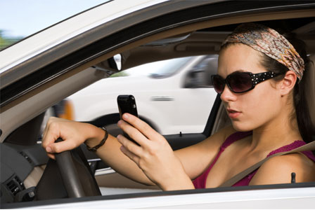 young-woman-driving-and-texting